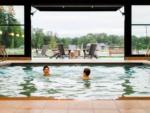 People in the pool and outdoor patio seating at ANGEL OF THE WINDS CASINO RESORT - thumbnail