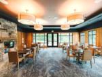 Interior of a dining area with stone fireplace at ANGEL OF THE WINDS CASINO RESORT - thumbnail