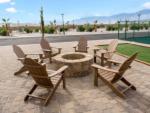 Chairs around a fire pit at PARADISE RV PARK - thumbnail