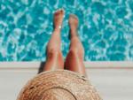 Woman in sun hat by the pool at PARADISE RV PARK - thumbnail