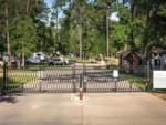 The secure entry gate at WOODLAND CREEK RV PARK - thumbnail