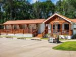 Exterior of laundry building and firewood for sale at WOODLAND CREEK RV PARK - thumbnail