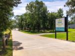 The park sign at the entrance to the park at WOODLAND CREEK RV PARK - thumbnail