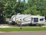 Fifth wheel with slide-out in paved site at Caravan RV - thumbnail