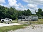 Large RV with a truck in a site at FRANK'S AT CANE HOLLOW RV PARK - thumbnail