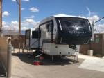 Fifth wheel with a slide-out at site at NOMADLAND RV STAY - thumbnail