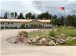 View of the office building from the road at CanAmerican 85 RV Park - thumbnail