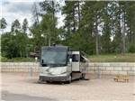 Class A motorhome and picnic table at CanAmerican 85 RV Park - thumbnail