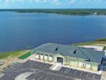 Aerial of exterior building and lake at WATERSIDE RV RESORT - thumbnail