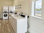 Laundry room with washer and dryers at WATERSIDE RV RESORT - thumbnail