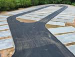 Paved road through sites at OLD FORT RV PARK - thumbnail