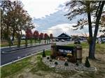 The sign at the entrance to the park at The Farm RV Resort - thumbnail