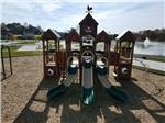 A large play structure on the playground at The Farm RV Resort - thumbnail