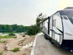 RV at site with a river view at RIVER'S EDGE CAMPGROUND - thumbnail