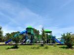 A play structure at the playground at RIVER'S EDGE CAMPGROUND - thumbnail