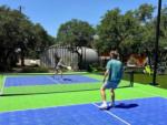 People playing pickle ball at RIVER'S EDGE CAMPGROUND - thumbnail