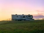 Travel trailer park at sunset at Escape With US RV Resort - thumbnail