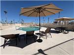 Umbrella by the pool - thumbnail