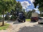 Shaded gravel sites at JESSIE JAMES JUNCTION RV PARK - thumbnail