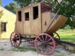 A wooden stagecoach at JESSIE JAMES JUNCTION RV PARK - thumbnail