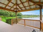 View of the lake from inside the gazebo at FARM OF DREAMS RESORT - thumbnail