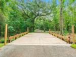 A driving bridge over a stream at FARM OF DREAMS RESORT - thumbnail