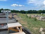 Picnic table at site at ROCK WALL RV PARK - thumbnail