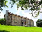 View of older home at ROCK WALL RV PARK - thumbnail