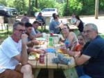 People eating at a picnic table at PINE RIDGE RV PARK - thumbnail