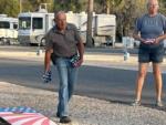 A couple playing corn hole at STEINHATCHEE VILLAGE RV PARK - thumbnail