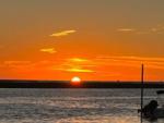 Sunset over the water at STEINHATCHEE VILLAGE RV PARK - thumbnail