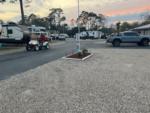 A person on a golf cart riding through the park at STEINHATCHEE VILLAGE RV PARK - thumbnail