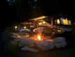 RV parked near fire pit at The Barlow RV Park - thumbnail