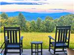 Chairs overlooking the park at The Oaks RV Resort - thumbnail