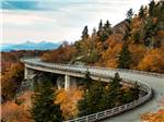 View of a bridge in the fall at The Oaks RV Resort - thumbnail