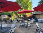 Tables with red umbrellas at APPLEGATE RV RESORT - thumbnail