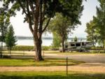 RV in a site at LAKESHORE CABINS AND CAMPGROUND - thumbnail