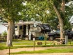 Shaded RV site at LAKESHORE CABINS AND CAMPGROUND - thumbnail