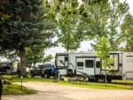 Camper outside his RV at LAKESHORE CABINS AND CAMPGROUND - thumbnail