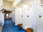 Park restrooms and shower stalls at LAKESHORE CABINS AND CAMPGROUND - thumbnail