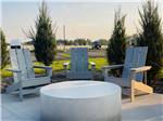 A patio with Adirondack seating at Sun Creek Point RV Park - thumbnail