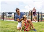 Man and dog in a dog park at Love's RV Stop - 660 - thumbnail