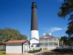 A lighthouse and house at PALM COVE RV VILLAGE - thumbnail