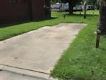 Paved site surrounded by grass at Birch Creek RV Park - thumbnail
