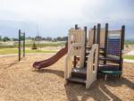 Children's playground with swings and slide at GOPHER GULCH RV & CAMPGROUND - thumbnail