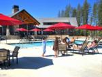 Red umbrellas around the pool at GRASS VALLEY RV RESORT - thumbnail