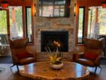 Fireplace area in the lobby at GRASS VALLEY RV RESORT - thumbnail