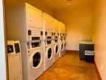 Laundry room with stackable washer and dryers at GRASS VALLEY RV RESORT - thumbnail