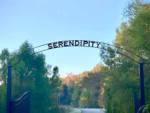 Iron gate with arch entrance at Serendipity Resort & Campground - thumbnail