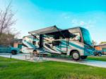 RV with open awning at CAMP FIMFO WACO - thumbnail